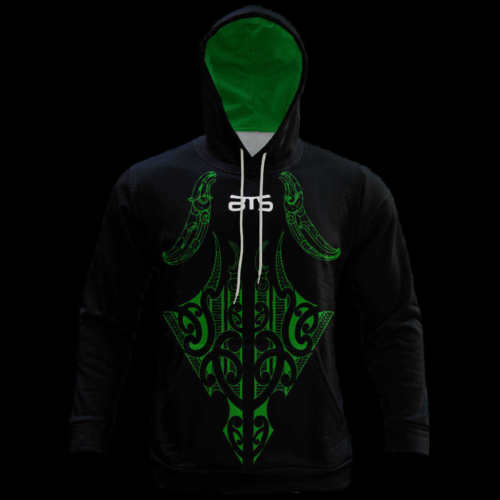 Black hoodie with green tribal design and visible brand logo on a dark background